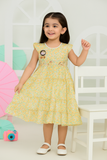 Young girl wearing a light yellow dress