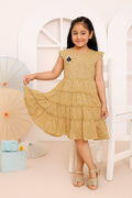 Young girl wearing a yellow dress with a white background