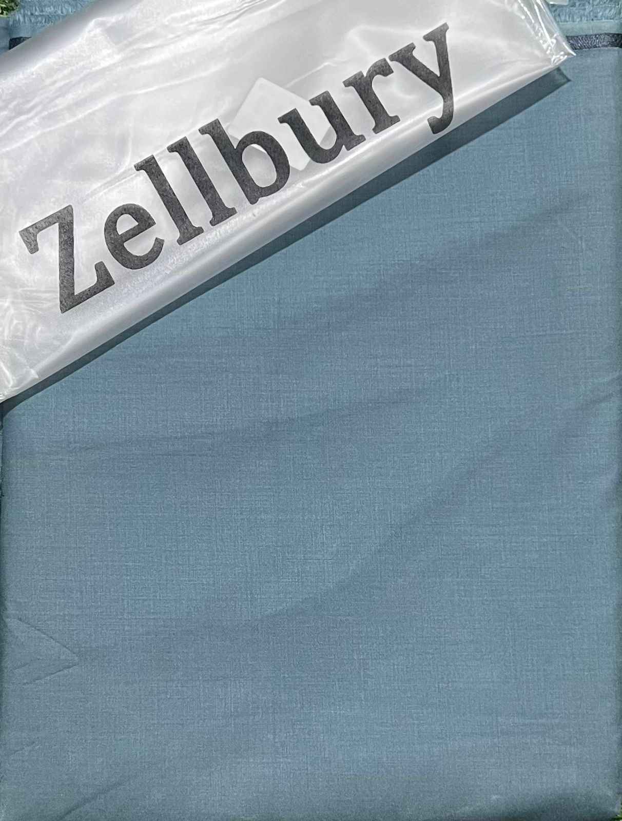 Zellbury fabric swatch with a blue color swatch on top