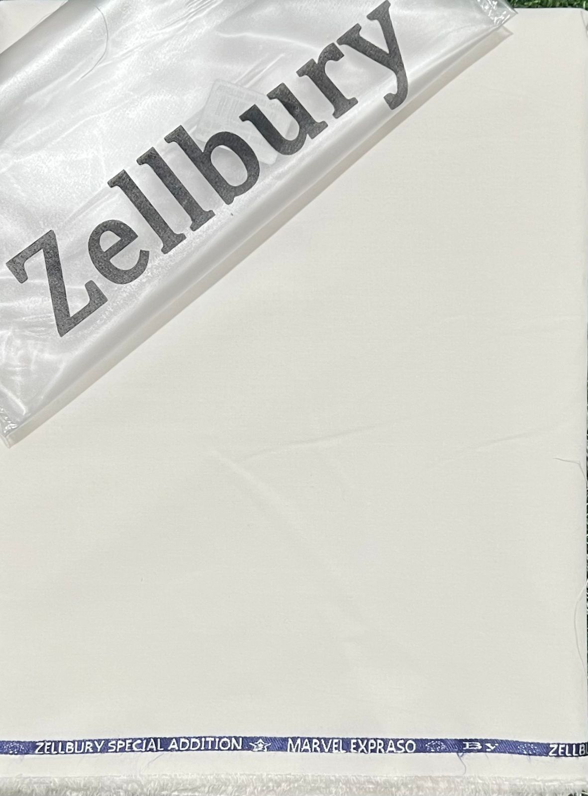 Zellbury suit product with a clear plastic cover on a white background