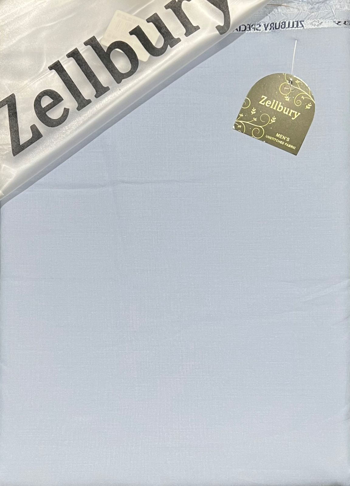 Zellbury product packaging with a gold tag on a light blue background