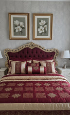 Decorative bedroom with ornate bed, floral artwork, and matching bedding.