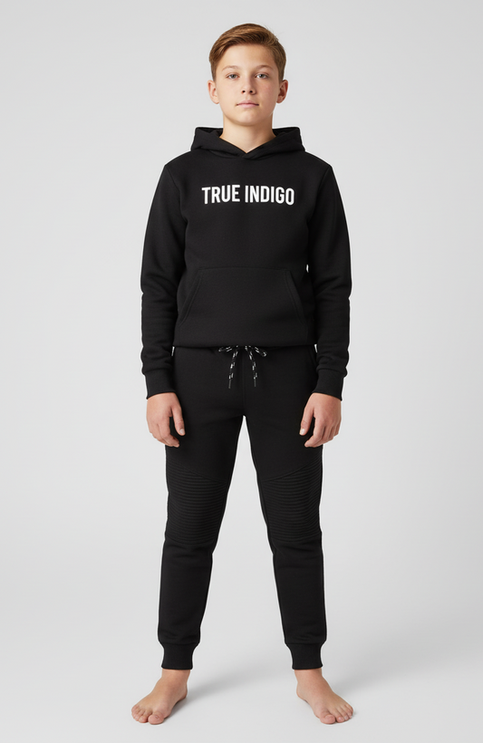 Person wearing a black hoodie with 'TRUE INDIGO' logo on a white background