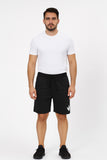 Man wearing a white t-shirt and black shorts on a white background
