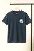 dark gray blue t-shirt with a logo on a hanger against a neutral background