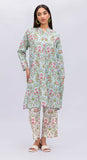 Woman wearing a floral dress and pants set on a white background