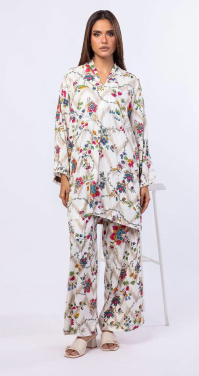 Woman wearing a floral outfit on a white background