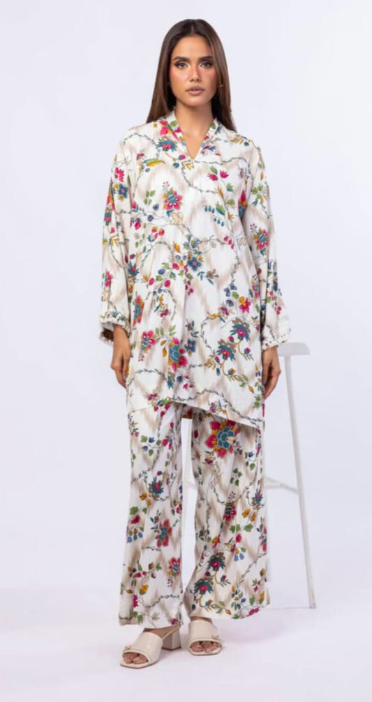 Woman wearing a floral outfit on a white background