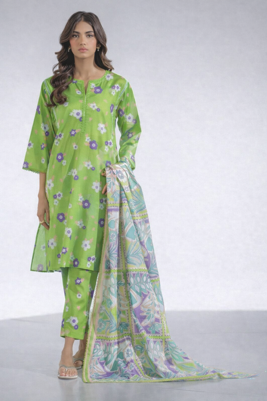 Woman wearing a green floral outfit with a matching dupatta on a white background