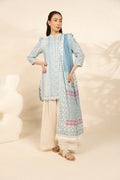 Woman wearing a light blue Printed traditional outfit with a matching dupatta on a beige background