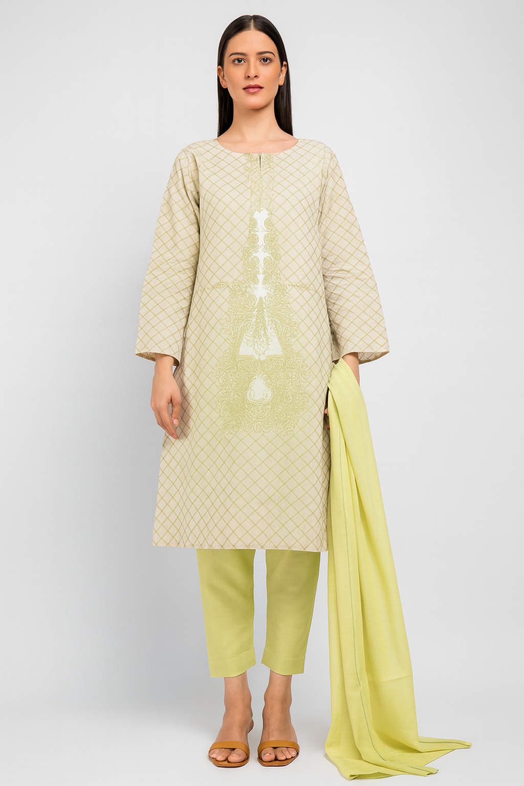 Woman wearing a light green kurta with matching pants and a yellow dupatta on a white background