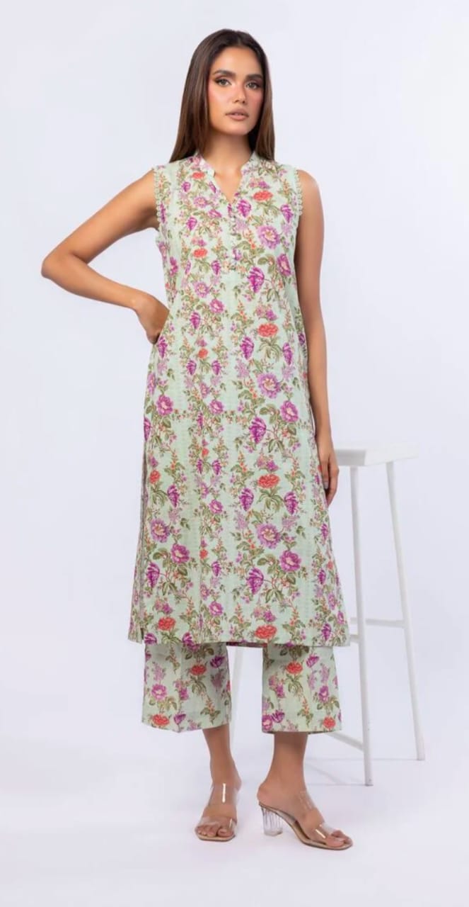 Woman wearing a lite pista floral dress with a white background