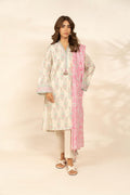 Woman wearing a traditional outfit with a floral kurta and pink dupatta on a beige background