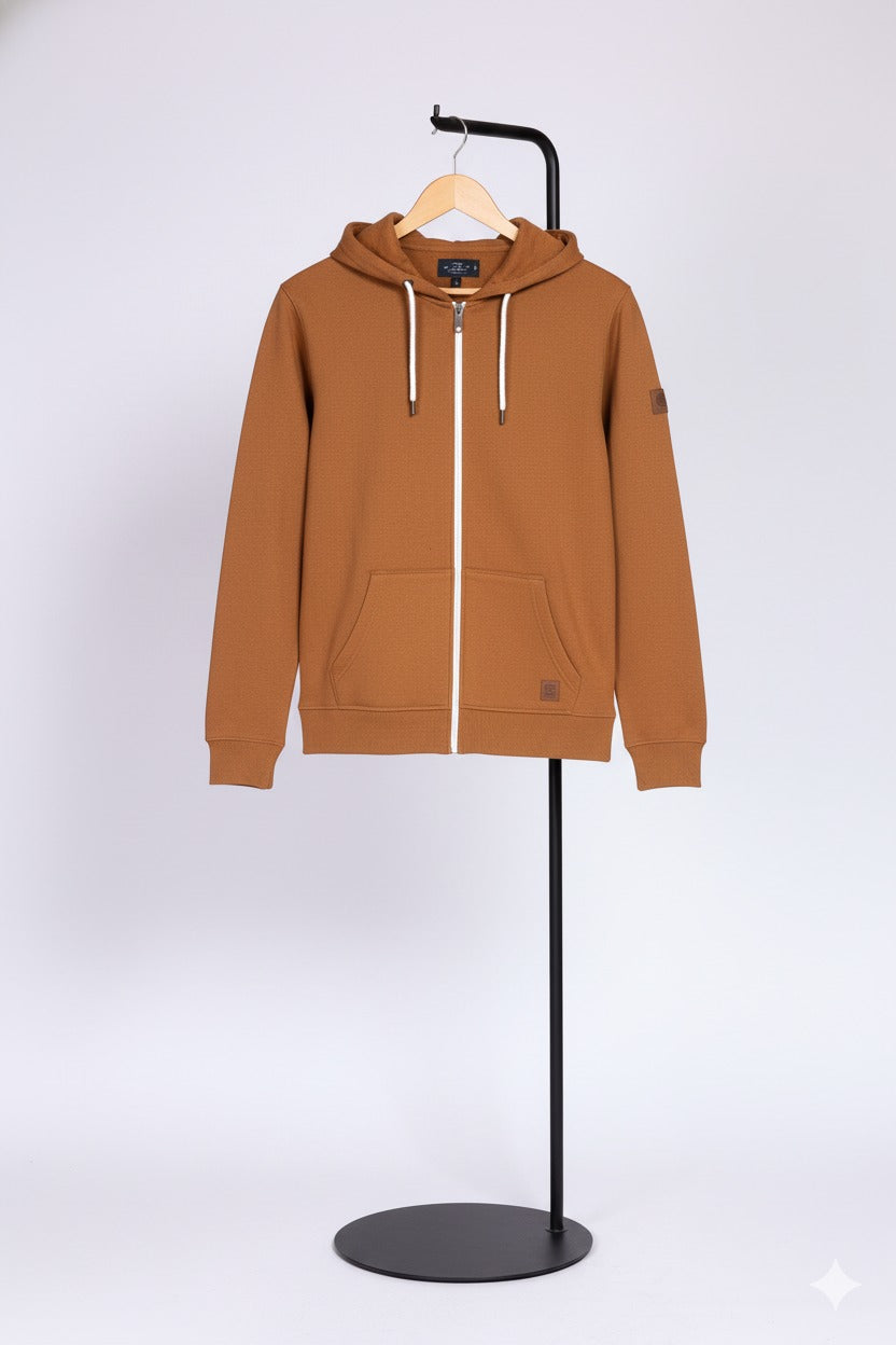 mastard hoodie on a black stand against a white background