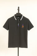 mhndi Polo shirt with logo on a hanger against a beige background