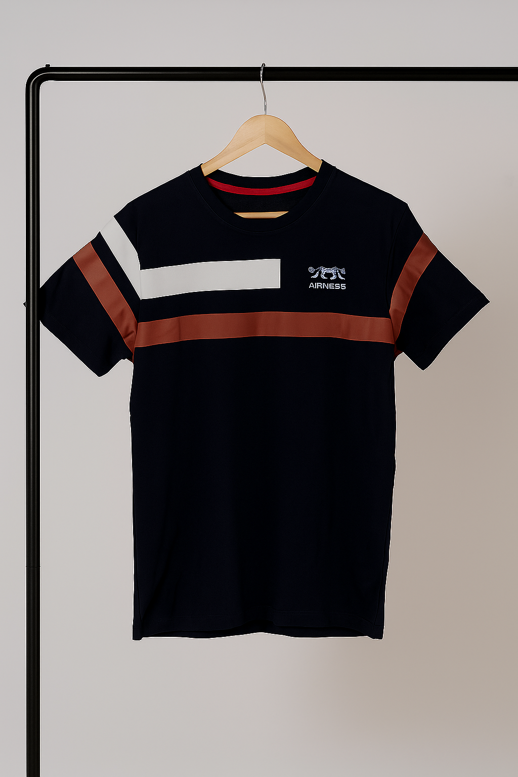 navy blue t-shirt with red and white stripes on a hanger against a plain background