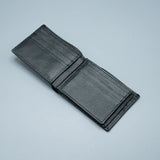 Black leather wallet on a light gray background