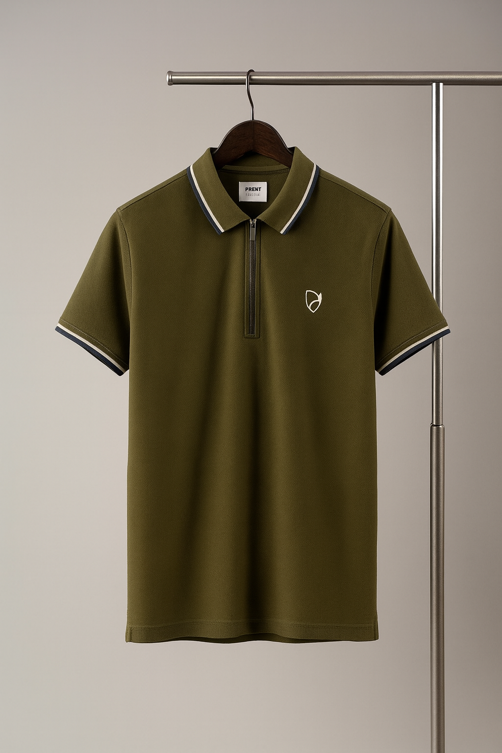olive Green polo shirt with a small logo on a hanger against a neutral background
