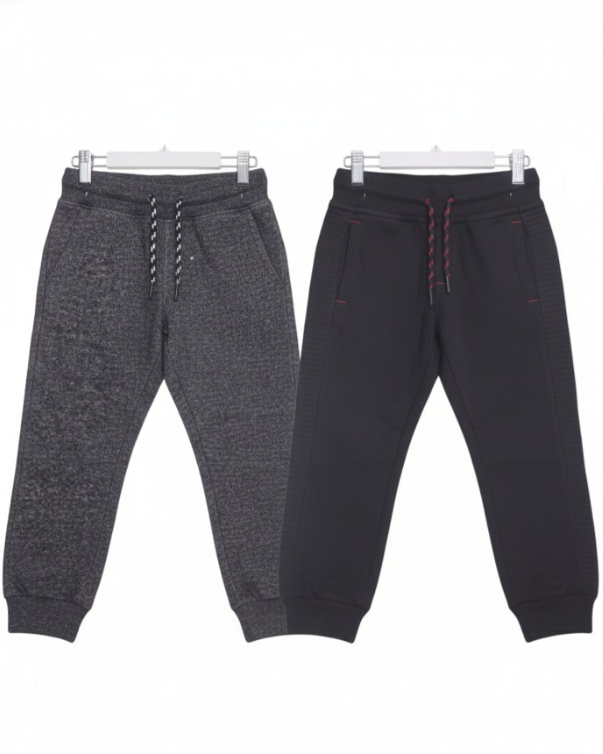 Two pairs of jogger pants, one gray and one black, on a white background.