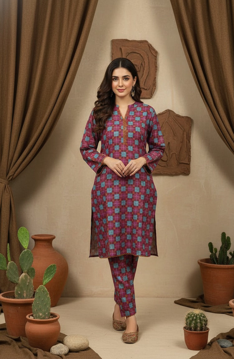 Woman wearing a patterned kurta with pants in a room with plants and decorative items.