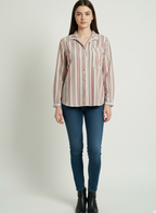 Woman wearing a striped shirt and blue jeans on a white background
