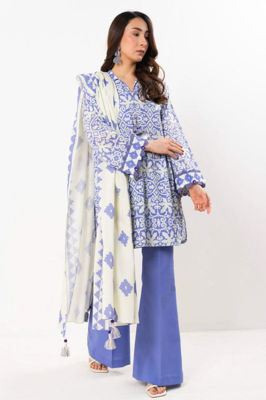 Woman wearing a blue and white patterned outfit with a matching dupatta on a white background