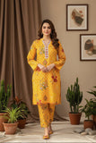 Woman in a yellow traditional outfit standing in a room with plants and decor.